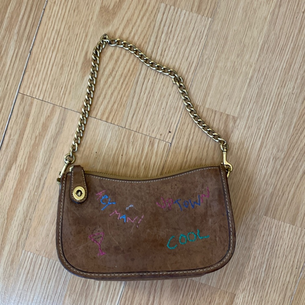Small coach bag.